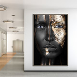 a woman's face with gold paint on it