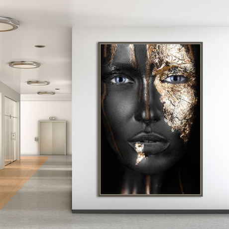 a woman's face with gold paint on it